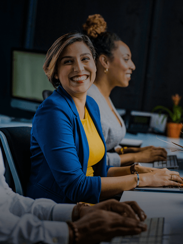 Happy employees use language learning platform in their workplace.