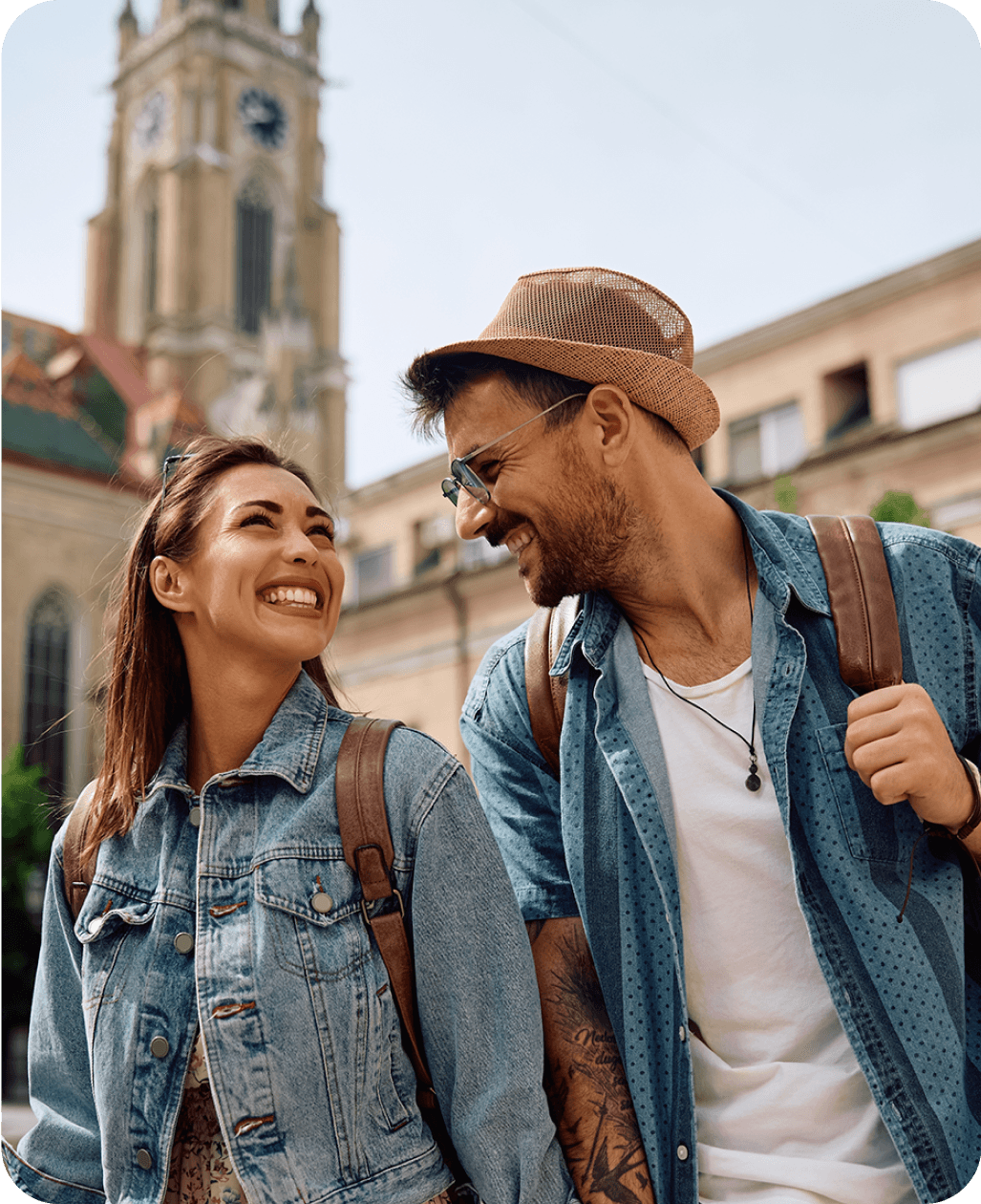 Smiling couple walking outdoors, representing real-world language use.